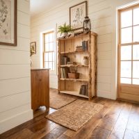Aspen Log Bookcase: Some lifestyle images are created with AI for visualization purposes. Crafted from natural solid wood, each piece is unique and will vary.