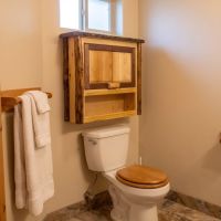 Toilet Topper Cabinet: Some lifestyle images are created with AI for visualization purposes. Crafted from natural solid wood, each piece is unique and will vary.