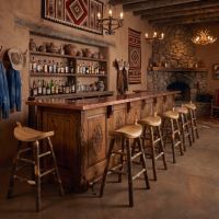 Hickory Saddle Stool: Some lifestyle images are created with AI for visualization purposes. Crafted from natural solid wood, each piece is unique and will vary.