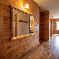 Cedar Log Mirror: Some lifestyle images are created with AI for visualization purposes. Crafted from natural solid wood, each piece is unique and will vary.