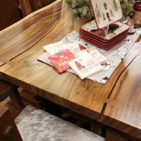 Golden Walnut tabletops come in a wide range of varying grain patterns & colors. The materials used to craft your table may not closely resemble those used in the pictured table(s). Many Golden Walnut tabletops feature checking & butterfly joinery.
