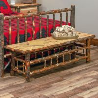 Cottage Hickory Log Bench shown at the end of a hickory bed