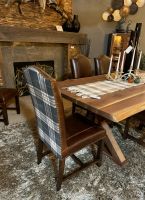 Bristol Tartan Dining Chair - Burnt Umber Cypress Leather & Charcoal Plaid Fabric Back, Shown with the Rustic Live Edge Wood Slab Trestle Dining Table